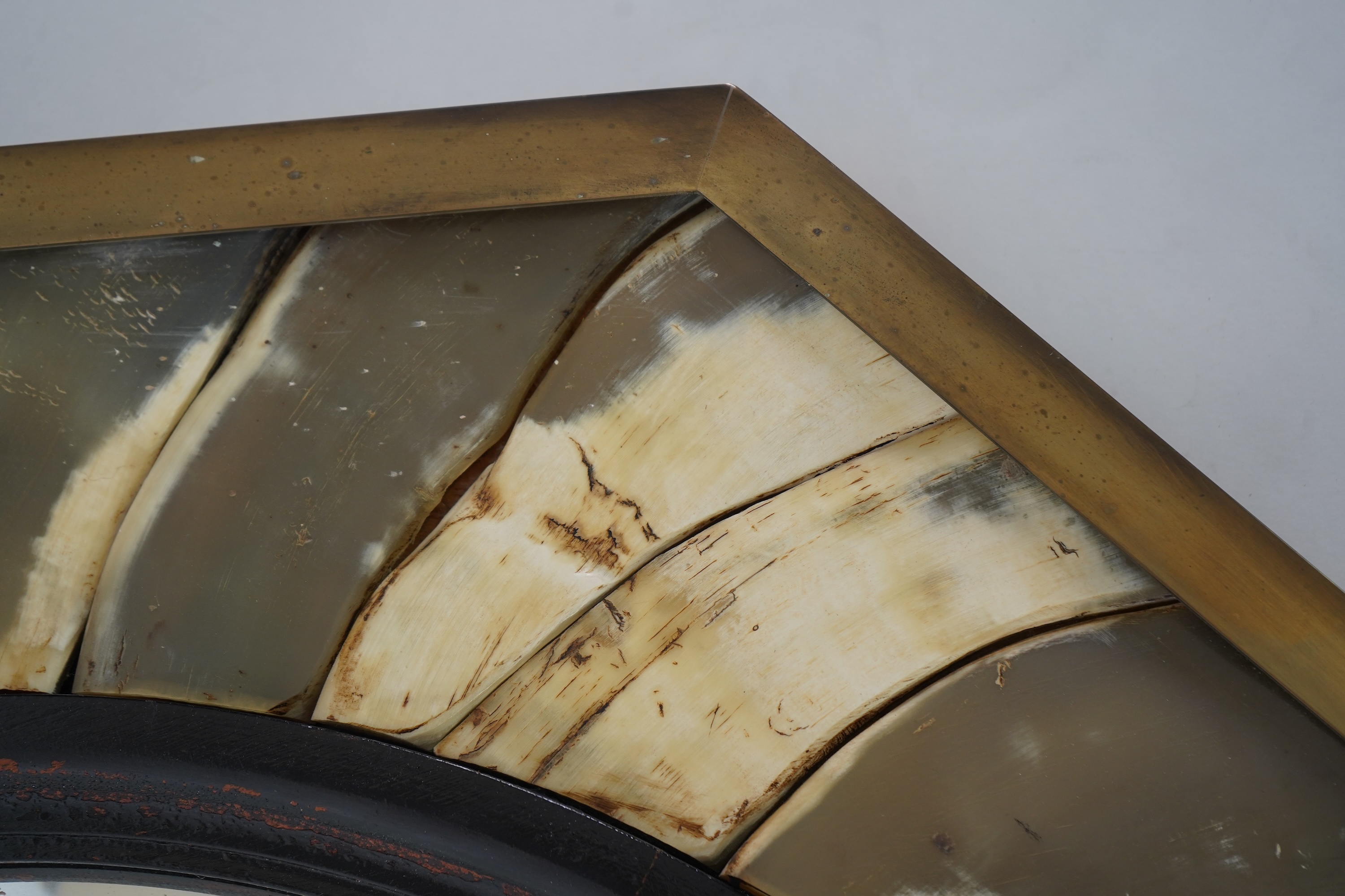 Anthony Redmile (b. 1940) An ebonised wood and horn mounted octagonal convex wall mirror